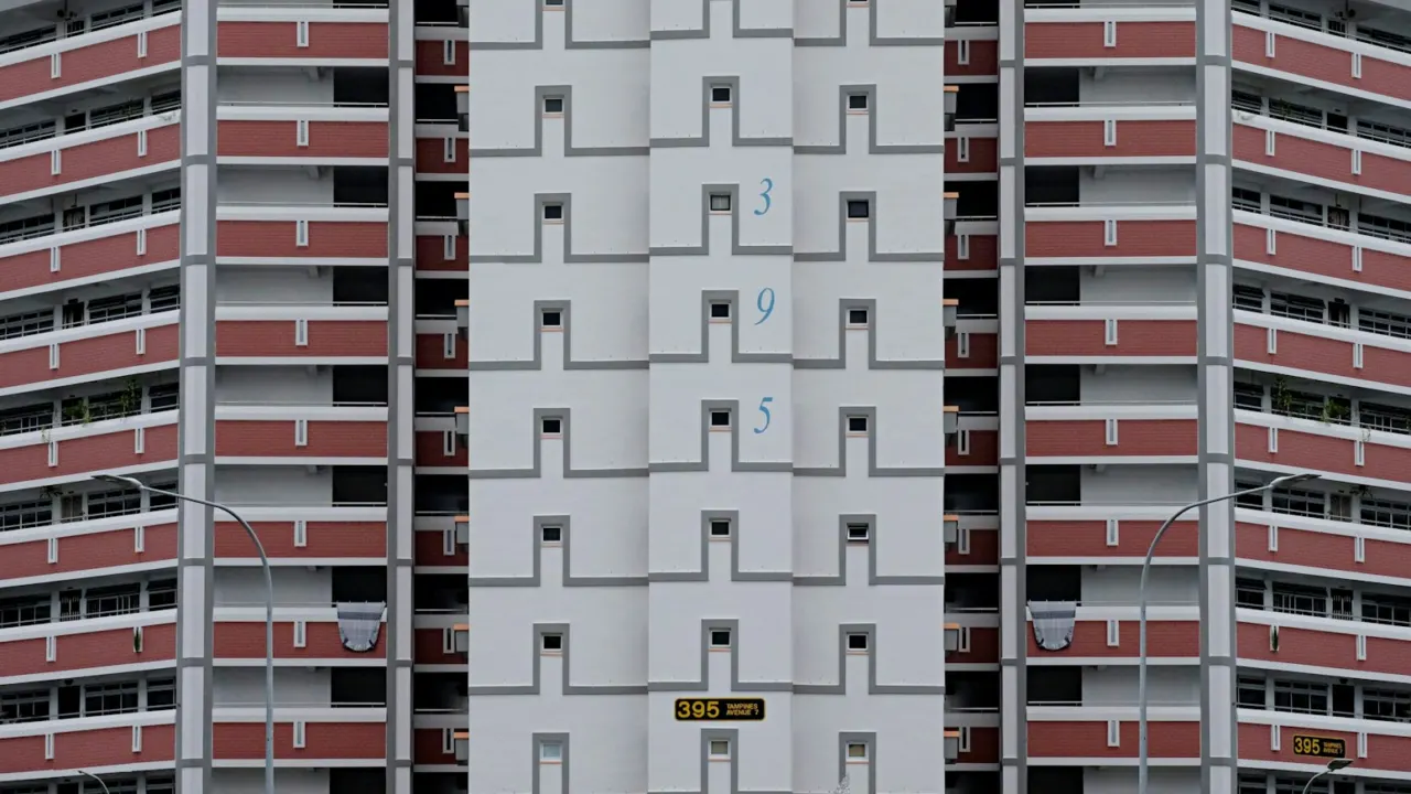 Facade of a residential block with repeating rows of windows, like the stacks and floors on an elevation chart