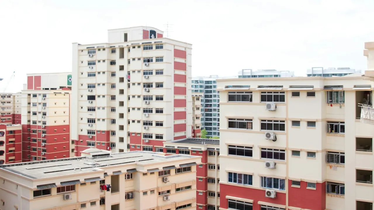 White apartment blocks under a cloudy sky in Singapore