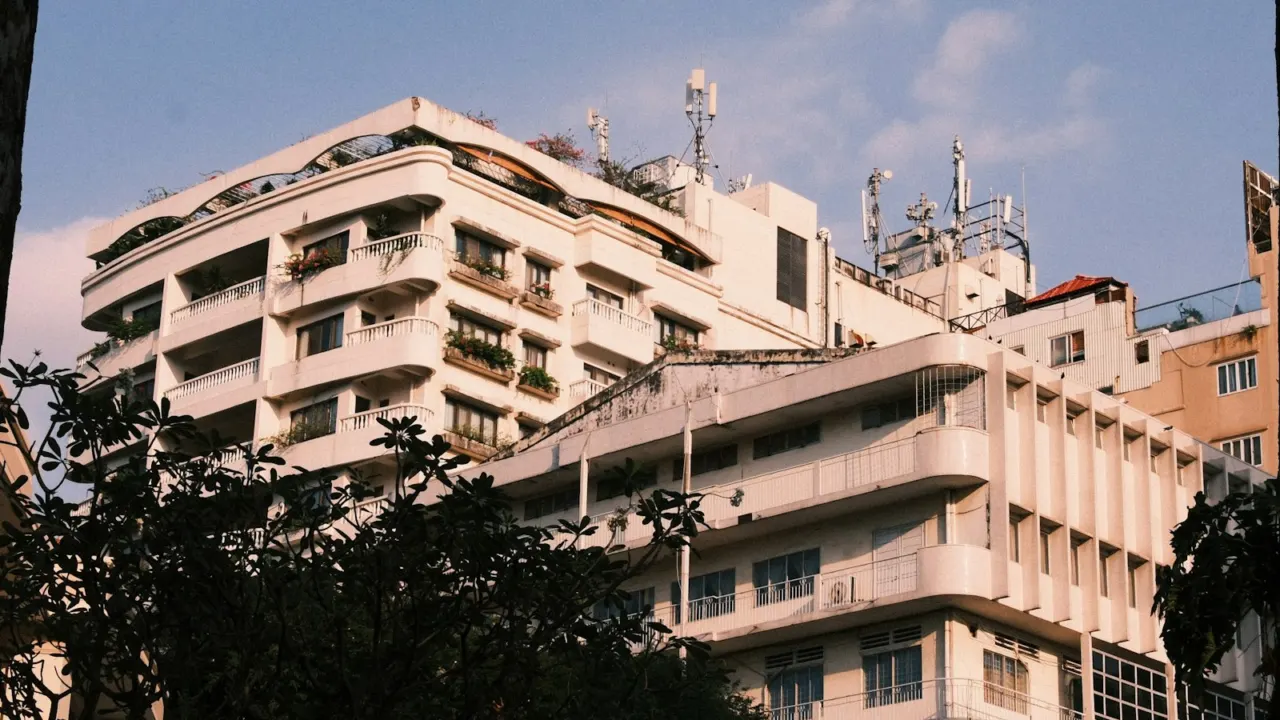 Apartment blocks against a blue sky, shown for illustration only