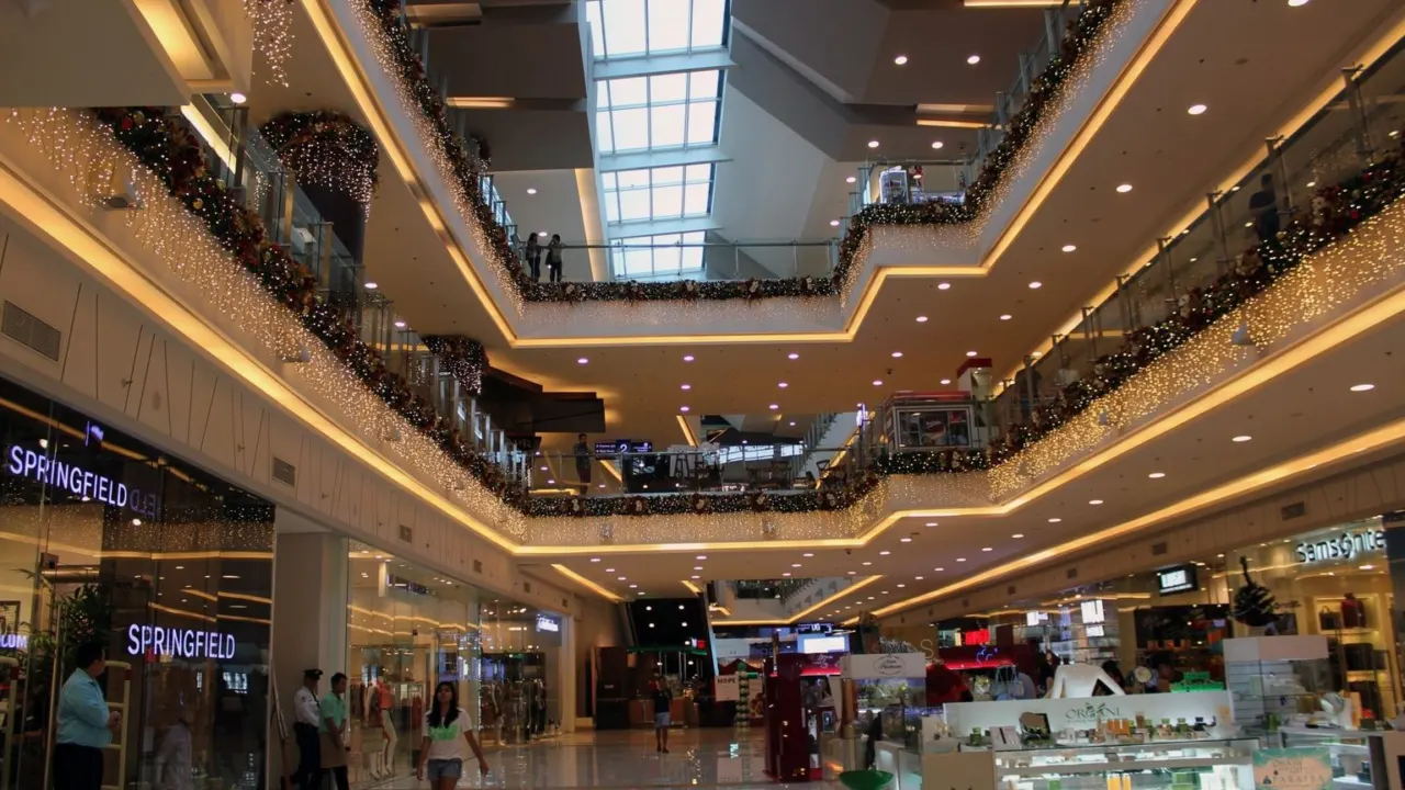 Interior of a modern shopping mall, representing the retail component planned at Hougang Central