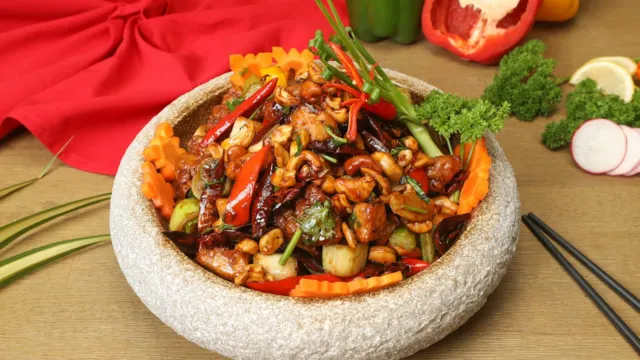 Bowl of stir-fried vegetables on a table, a typical zi char side dish
